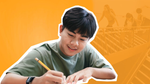Student studying and writing