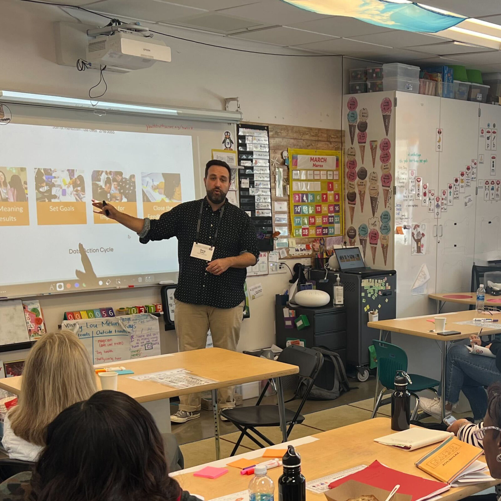 Doug Keller presenting to a classroom of seated students.